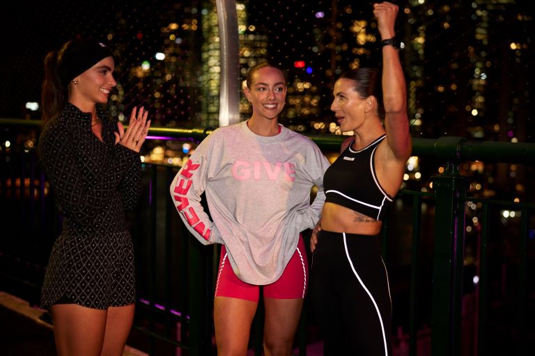 Anabelle Ronnfeldt, Caity Viant and Emily Merrin on the Brisbane Story Bridge